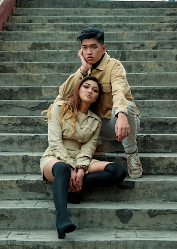 Man and Woman Sitting on Stairs