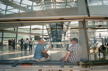 Man and Woman Sitting on Waiting Area