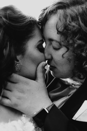 man and woman stancing to kiss grayscale photo