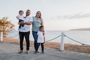 Man and Woman Standing Alongside With Their Children