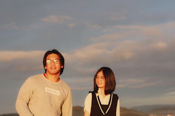 Man and Woman Standing Beside Each other