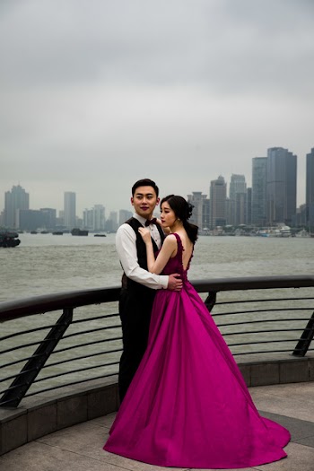 Man and Woman Standing Beside Fence
