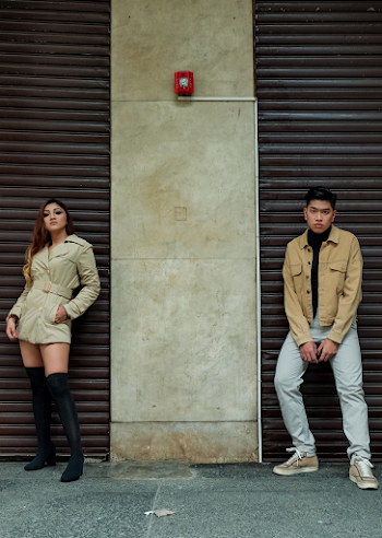 Man and Woman Standing Beside Wall