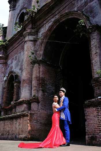Man and Woman Standing in Front of Church