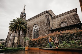 Man and Woman Standing Near Church