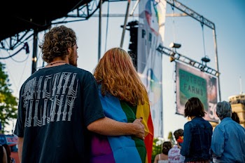 Man and Woman Standing Near on Stage
