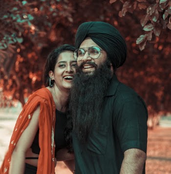 Man and Woman Standing Near Tree