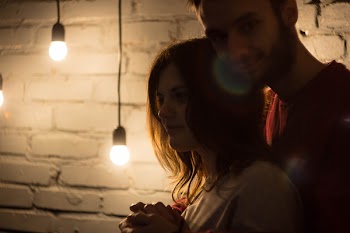 Man and Woman Standing Near Wall