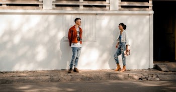 Man and Woman Standing Near Wall