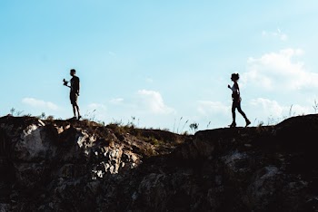 Man and Woman Standing on Mountain