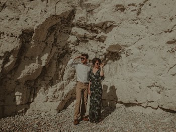Man and Woman Standing on Rock Formation