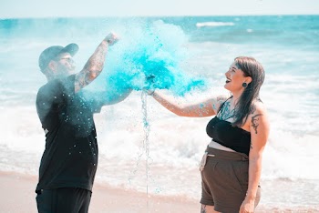 Man And Woman Standing On Seashore