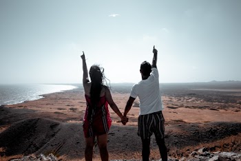 Man and Woman Standing on Soil