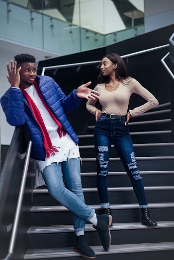 Man and Woman Standing on Stairs
