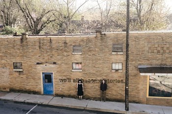 man and woman standing on wall