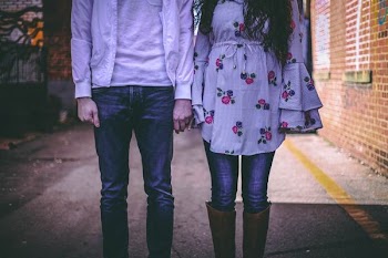 man and woman standing side by side