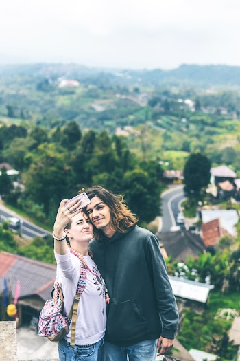 Man and Woman Taking Photo
