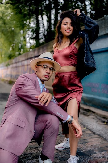 Man and Woman Taking Photo Outside