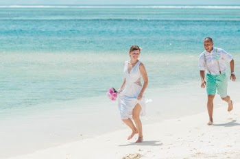 Man and Woman Walking by the Sea