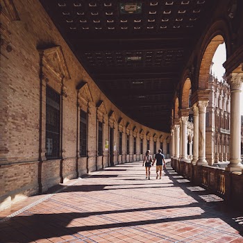 Man And Woman Walking On Hallway 
