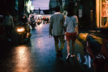 Man and Woman Walking on Street