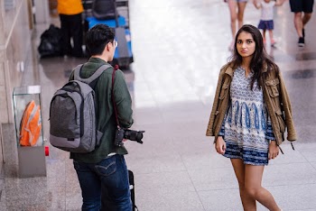 Man and Woman Walking Towards Each Other