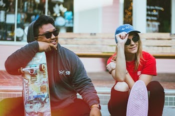 man and woman wearing black sunglasses