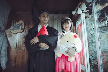Man and Woman Wearing Traditional Dresses