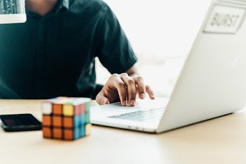 Man At Computer Using Trackpad