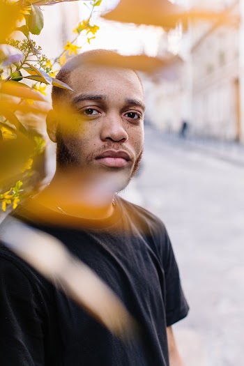 Man Behind Plant