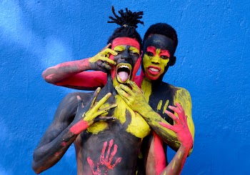 Man Beside a Woman in Body Paint