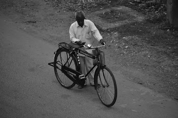 Man Beside Bicycle 