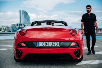 Man Beside Euro Sports Car