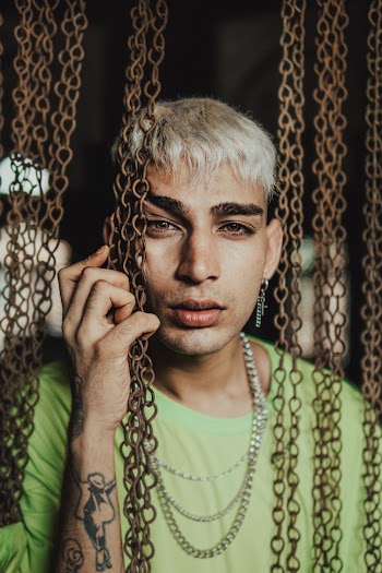 Man Beside Hanging Chains
