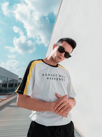 Man Beside White Wall