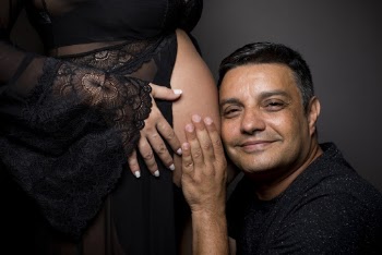 Man Beside Woman's Belly