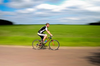 Man Biking on Road