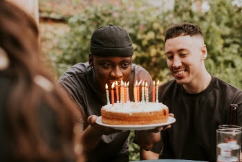 Man blowing candles on top | Free Photo - rawpixel