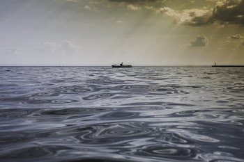 Man Canoeing On Water
