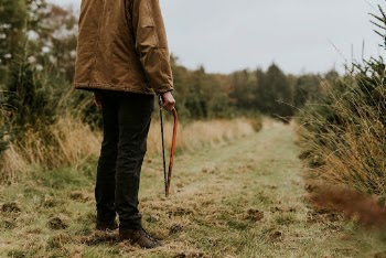 Man carrying a bow saw | Free Photo - rawpixel