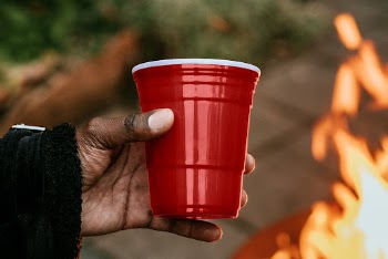 Man carrying a party cup | Free Photo - rawpixel