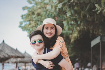 Man Carrying A Woman On His Back