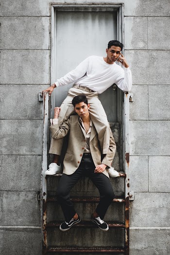 Man Carrying Another Man on Stairway