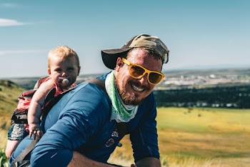 Man Carrying Baby 