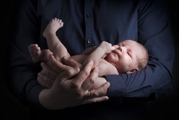 Man Carrying Baby