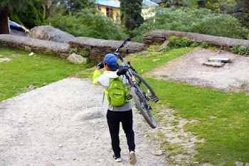 Man Carrying Bicycle