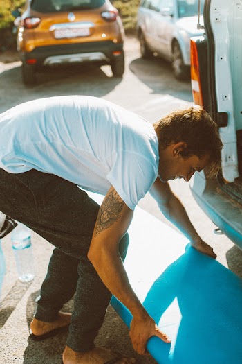 Man Carrying Blue Board
