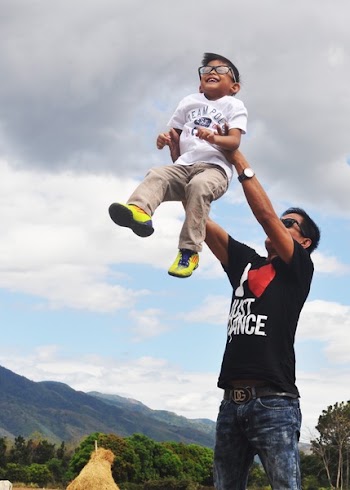 Man Carrying Boy