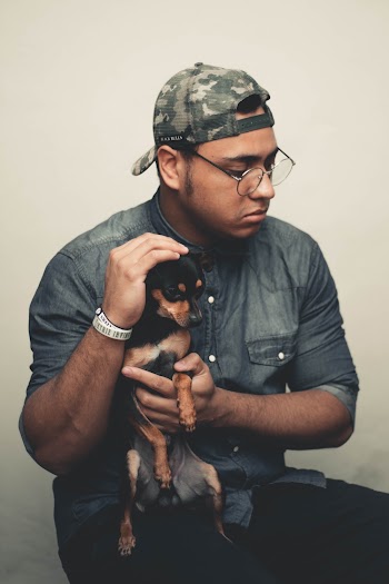 Man Carrying Dog