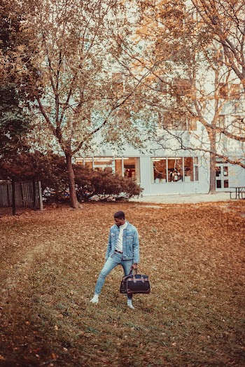 Man Carrying Duffel Bag